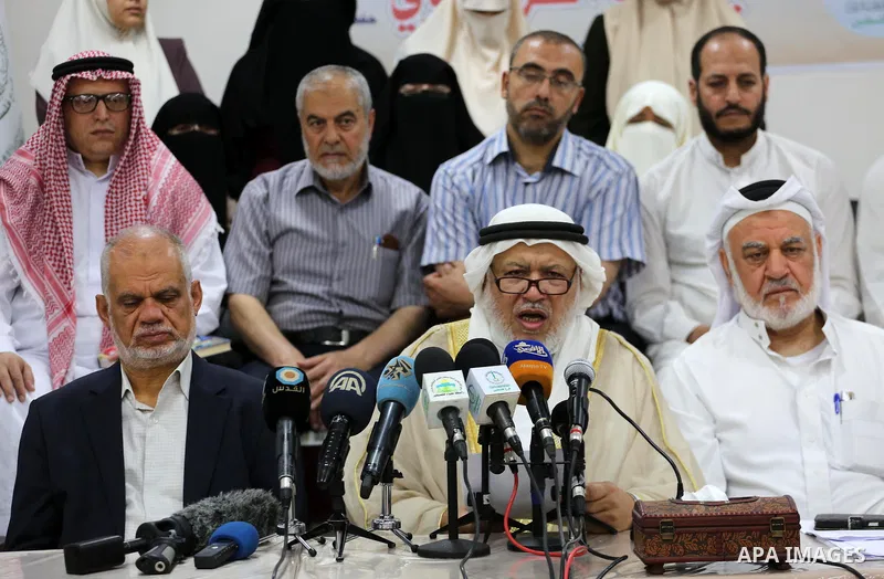 Marwan Abu Ras, a head of the Palestine Scholars Association, speaks during a press conference to show solidarity with Sheikh Yusuf al-Qaradawi in Gaza city on June 11, 2017. The Muslim World League announced the termina...