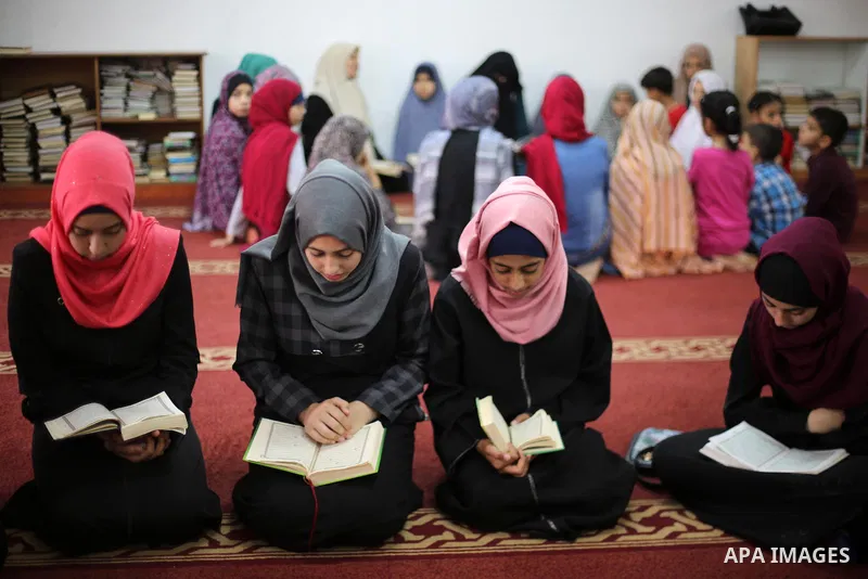 Palestinian girls attend a lesson of Koran, Islam's holiest book on the Muslim holy fasting month of Ramadan, at Dar Al Ketab and Sunna in Gaza city, on June 12, 2017. Ramadan is sacred to Muslims because it is during th...