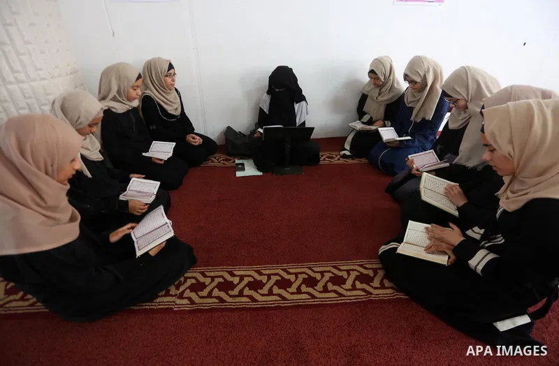 Palestinian girls attend a lesson of Koran, Islam's holiest book on the Muslim holy fasting month of Ramadan, at Dar Al Ketab and Sunna in Gaza city, on June 12, 2017. Ramadan is sacred to Muslims because it is during th...