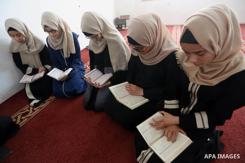 Palestinian girls attend a lesson of Koran, Islam's holiest book on the Muslim holy fasting month of Ramadan, at Dar Al Ketab and Sunna in Gaza city, on June 12, 2017. Ramadan is sacred to Muslims because it is during th...