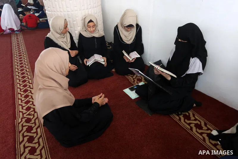 Palestinian girls attend a lesson of Koran, Islam's holiest book on the Muslim holy fasting month of Ramadan, at Dar Al Ketab and Sunna in Gaza city, on June 12, 2017. Ramadan is sacred to Muslims because it is during th...