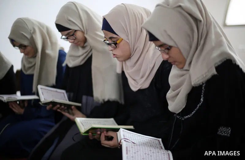 Palestinian girls attend a lesson of Koran, Islam's holiest book on the Muslim holy fasting month of Ramadan, at Dar Al Ketab and Sunna in Gaza city, on June 12, 2017. Ramadan is sacred to Muslims because it is during th...