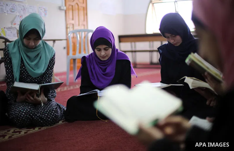 Palestinian girls attend a lesson of Koran, Islam's holiest book on the Muslim holy fasting month of Ramadan, at Dar Al Ketab and Sunna in Gaza city, on June 12, 2017. Ramadan is sacred to Muslims because it is during th...