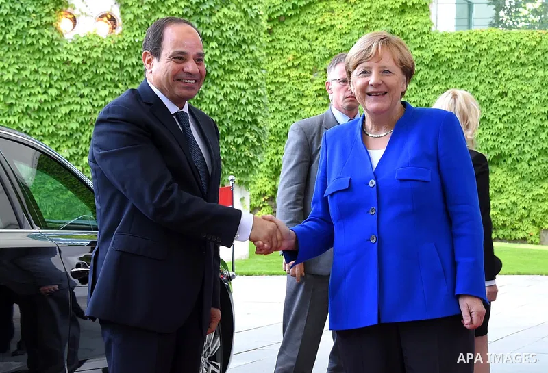 German Chancellor Angela Merkel greets Egyptian President Abdel Fattah al-Sisi as he arrives at the chancellory on the sidelines of a two-day G20 Africa partnership investment conference in Berlin on June 12, 2017. Photo...