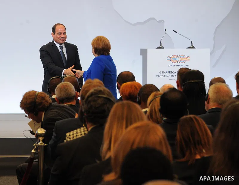 German Chancellor Angela Merkel shakes hands with the President of Egypt, Abdel Fattah el-Sisi during a two-day G20 Africa partnership investment conference in Berlin on June 12, 2017. Photo by Egyptian President Office