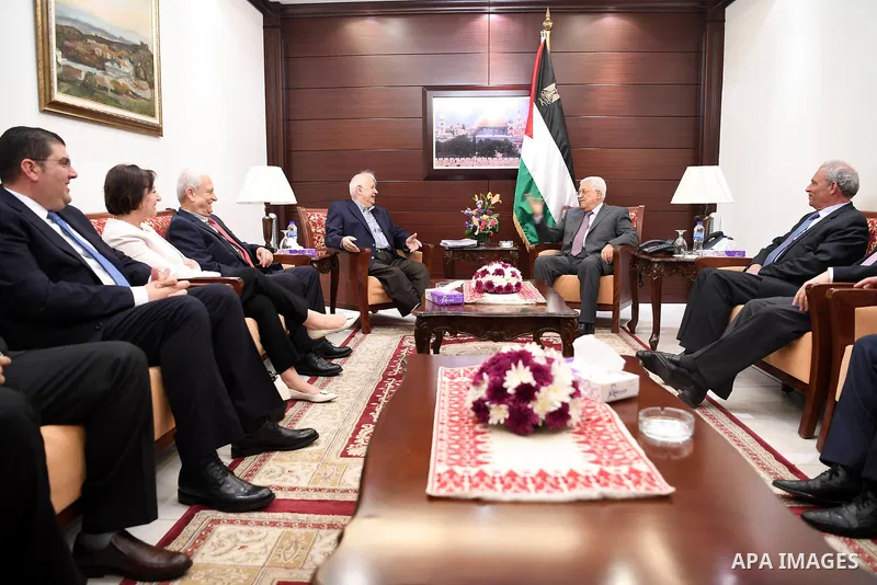 Palestinian President Mahmoud Abbas (Abu Mazen) meets with the Palestinian chief of Election Commissioner, Hanna Nasser, in the West Bank city of Ramallah, on June 12, 2017. Photo by Osama Falah