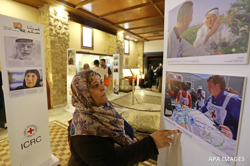 Palestinians participate in a photo gallery organized by Red cross (ICRC) on the occasion of over 50 years of its presence in the occupied Palestinian territories, in Gaza city on June 13, 2017. Photo by Ashraf Amra