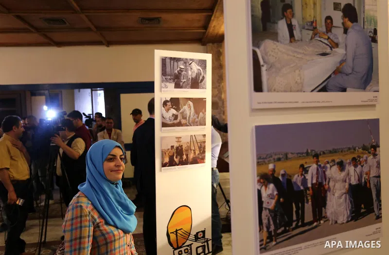 Palestinians participate in a photo gallery organized by Red cross (ICRC) on the occasion of over 50 years of its presence in the occupied Palestinian territories, in Gaza city on June 13, 2017. Photo by Ashraf Amra