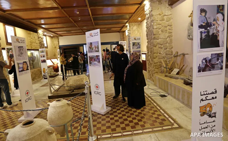 Palestinians participate in a photo gallery organized by Red cross (ICRC) on the occasion of over 50 years of its presence in the occupied Palestinian territories, in Gaza city on June 13, 2017. Photo by Ashraf Amra