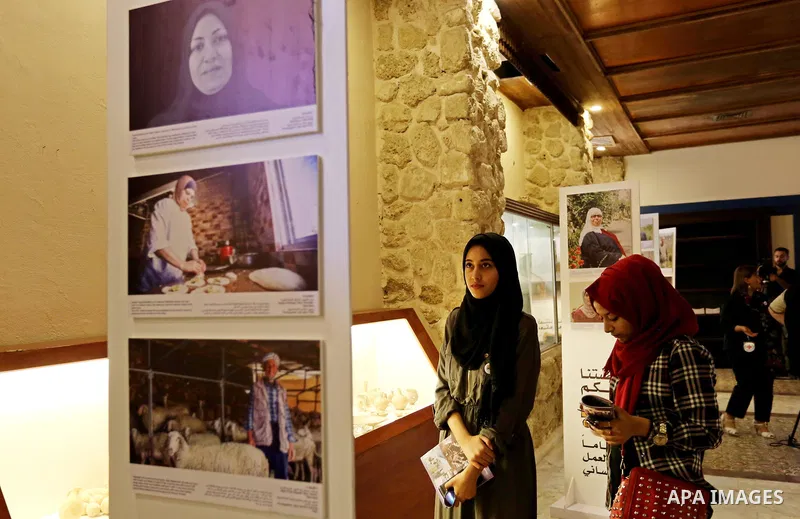 Palestinians participate in a photo gallery organized by Red cross (ICRC) on the occasion of over 50 years of its presence in the occupied Palestinian territories, in Gaza city on June 13, 2017. Photo by Ashraf Amra