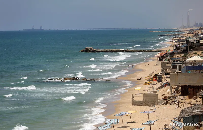 Palestinians walk at the beach of Gaza city on the Muslim holy fasting month of Ramadan, in Gaza city on June 13, 2017. Ramadan is sacred to Muslims because it is during that month that tradition says the Koran was revea...