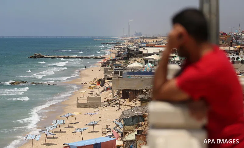 Palestinians walk at the beach of Gaza city on the Muslim holy fasting month of Ramadan, in Gaza city on June 13, 2017. Ramadan is sacred to Muslims because it is during that month that tradition says the Koran was revea...