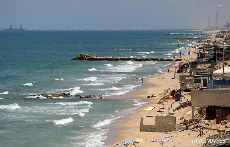 Palestinians walk at the beach of Gaza city on the Muslim holy fasting month of Ramadan, in Gaza city on June 13, 2017. Ramadan is sacred to Muslims because it is during that month that tradition says the Koran was revea...