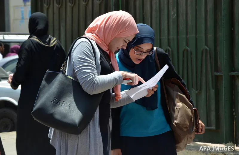 Egyptian students react following a high school exams in Cairo, Egypt, on June 13, 2017. Photo by Amr Sayed
