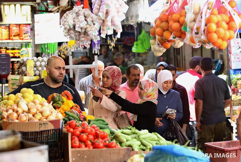 A Palestinian vendor sells vegetables and fruits at a market on the Muslim holy fasting month of Ramadan in the Old City of the West Bank town of Nablus, on June 13, 2017. Ramadan is sacred to Muslims because it is durin...
