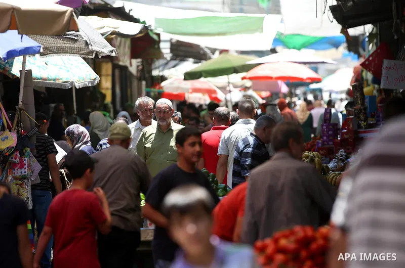 Palestinians shop at a market on the Muslim holy fasting month of Ramadan in the Old City of the West Bank town of Nablus, on June 13, 2017. Ramadan is sacred to Muslims because it is during that month that tradition say...
