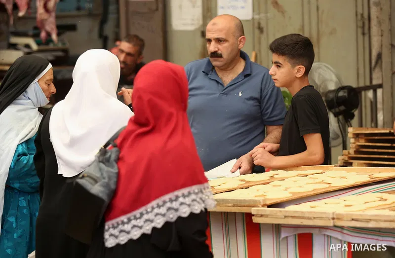 A Palestinian vendor sells traditional pancakes known as ''Qatayef'' at a market on the Muslim holy fasting month of Ramadan in the Old City of the West Bank town of Nablus, on June 13, 2017. Ramadan is sacred to Muslims...