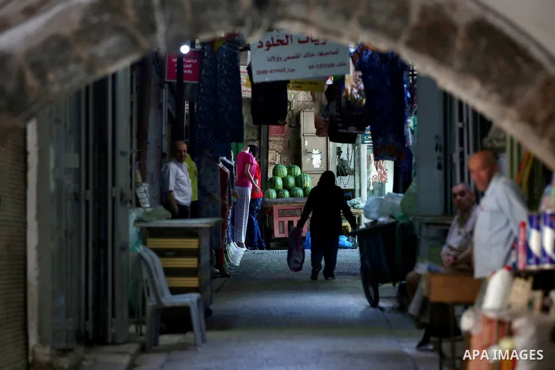 Palestinians shop at a market on the Muslim holy fasting month of Ramadan in the Old City of the West Bank town of Nablus, on June 13, 2017. Ramadan is sacred to Muslims because it is during that month that tradition say...
