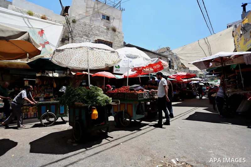 Palestinians shop at a market on the Muslim holy fasting month of Ramadan in the Old City of the West Bank town of Nablus, on June 13, 2017. Ramadan is sacred to Muslims because it is during that month that tradition say...
