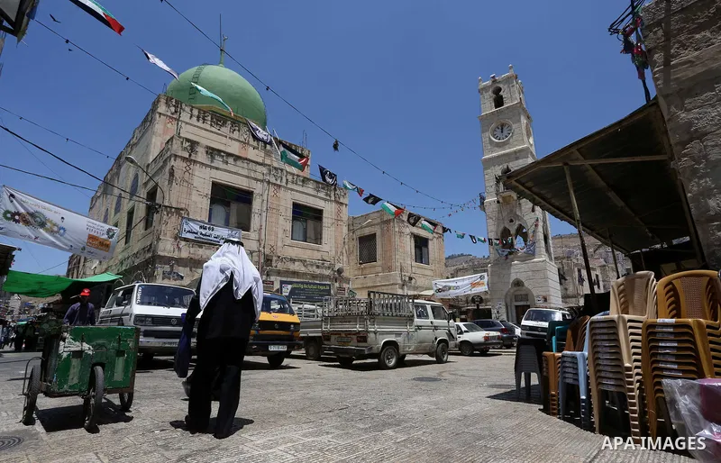 Palestinians shop at a market on the Muslim holy fasting month of Ramadan in the Old City of the West Bank town of Nablus, on June 13, 2017. Ramadan is sacred to Muslims because it is during that month that tradition say...