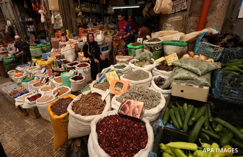 Palestinians shop at a market on the Muslim holy fasting month of Ramadan in the Old City of the West Bank town of Nablus, on June 13, 2017. Ramadan is sacred to Muslims because it is during that month that tradition say...