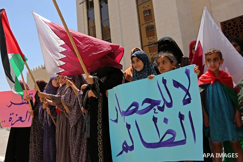 Palestinian women take part in a rally in support of Qatar, inside Qatari-funded construction project 'Hamad City', in Khan Younis in the southern Gaza Strip, June 14, 2017. Photo by Ashraf Amra