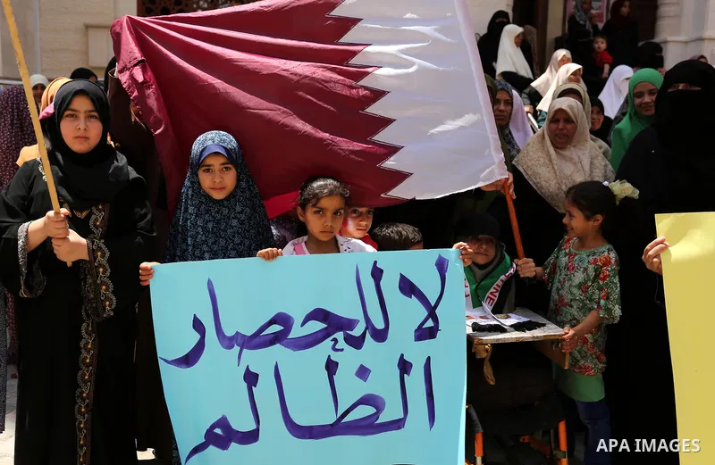 Palestinian women take part in a rally in support of Qatar, inside Qatari-funded construction project 'Hamad City', in Khan Younis in the southern Gaza Strip, June 14, 2017. Photo by Ashraf Amra