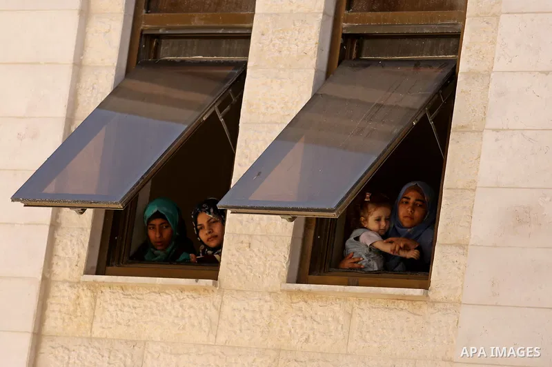 Palestinian women take part in a rally in support of Qatar, inside Qatari-funded construction project 'Hamad City', in Khan Younis in the southern Gaza Strip, June 14, 2017. Photo by Ashraf Amra