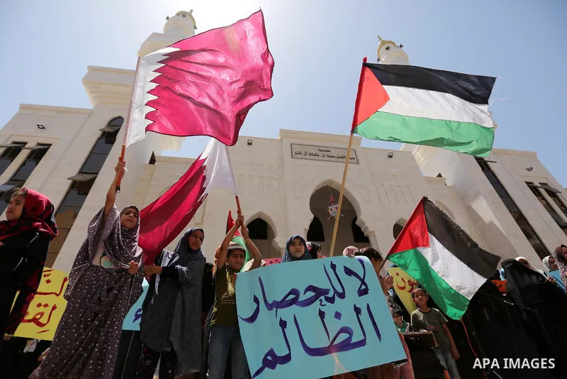 Palestinian women take part in a rally in support of Qatar, inside Qatari-funded construction project 'Hamad City', in Khan Younis in the southern Gaza Strip, June 14, 2017. Photo by Ashraf Amra