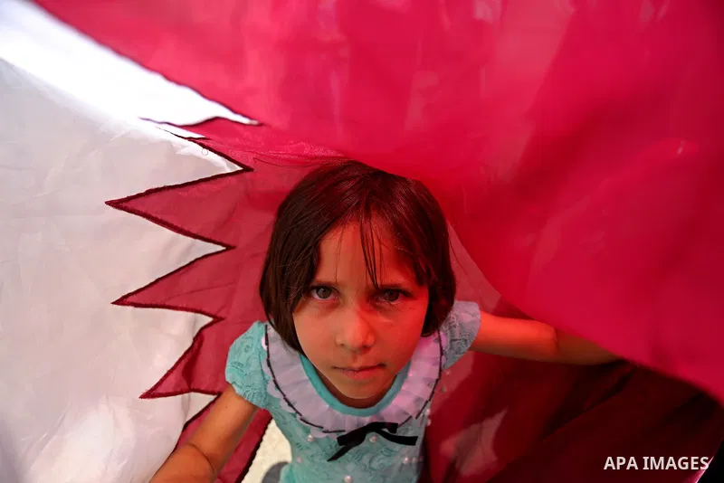 Palestinian women take part in a rally in support of Qatar, inside Qatari-funded construction project 'Hamad City', in Khan Younis in the southern Gaza Strip, June 14, 2017. Photo by Ashraf Amra