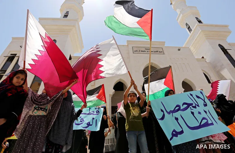 Palestinian women take part in a rally in support of Qatar, inside Qatari-funded construction project 'Hamad City', in Khan Younis in the southern Gaza Strip, June 14, 2017. Photo by Ashraf Amra
