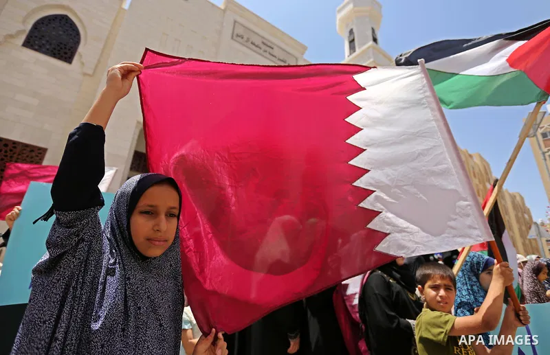 Palestinian women take part in a rally in support of Qatar, inside Qatari-funded construction project 'Hamad City', in Khan Younis in the southern Gaza Strip, June 14, 2017. Photo by Ashraf Amra