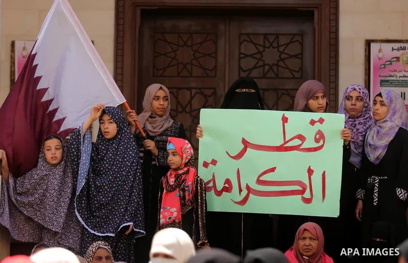 Palestinian women take part in a rally in support of Qatar, inside Qatari-funded construction project 'Hamad City', in Khan Younis in the southern Gaza Strip, June 14, 2017. Photo by Ashraf Amra