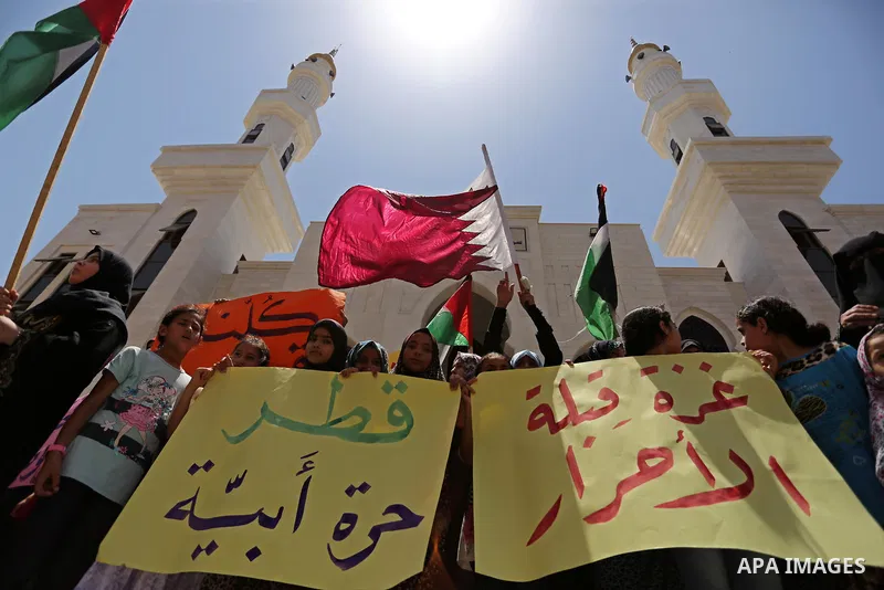 Palestinian women take part in a rally in support of Qatar, inside Qatari-funded construction project 'Hamad City', in Khan Younis in the southern Gaza Strip, June 14, 2017. Photo by Ashraf Amra