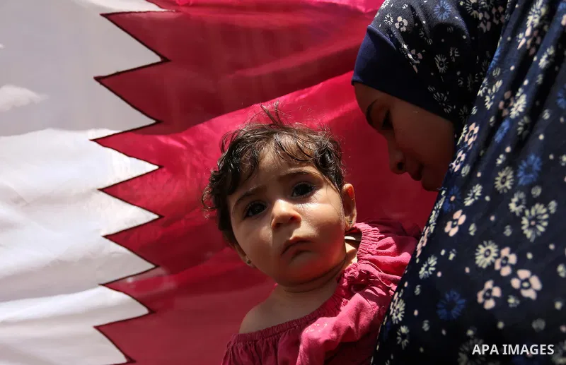 Palestinian women take part in a rally in support of Qatar, inside Qatari-funded construction project 'Hamad City', in Khan Younis in the southern Gaza Strip, June 14, 2017. Photo by Ashraf Amra
