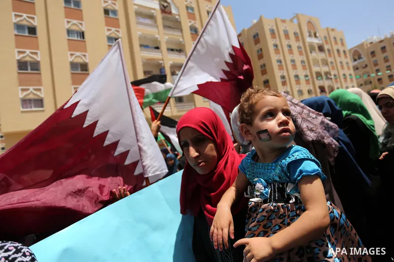 Palestinian women take part in a rally in support of Qatar, inside Qatari-funded construction project 'Hamad City', in Khan Younis in the southern Gaza Strip, June 14, 2017. Photo by Ashraf Amra