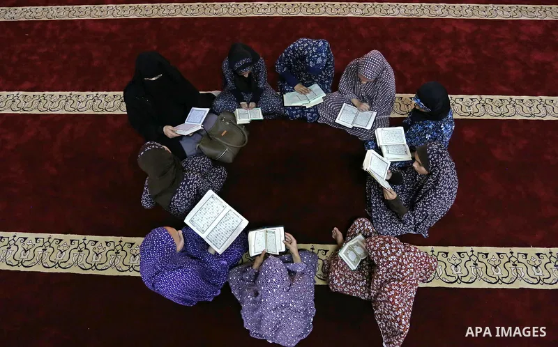 Palestinian girls attend a lesson of Koran, Islam's holiest book on the Muslim holy fasting month of Ramadan, at Hamad Mosque in Khan Younis in the southern Gaza Strip, June 14, 2017. Ramadan is sacred to Muslims because...