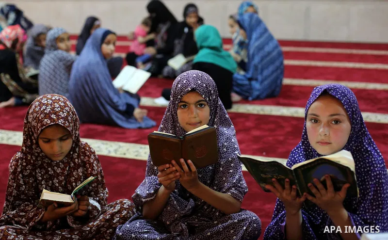 Palestinian girls attend a lesson of Koran, Islam's holiest book on the Muslim holy fasting month of Ramadan, at Hamad Mosque in Khan Younis in the southern Gaza Strip, June 14, 2017. Ramadan is sacred to Muslims because...