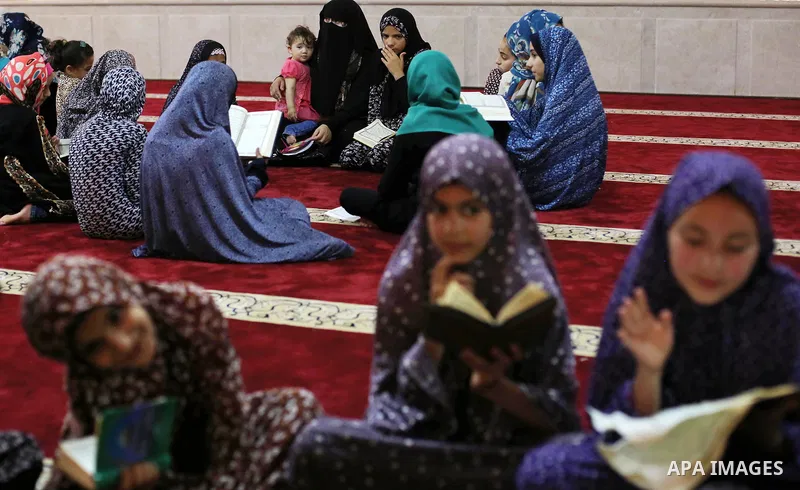 Palestinian girls attend a lesson of Koran, Islam's holiest book on the Muslim holy fasting month of Ramadan, at Hamad Mosque in Khan Younis in the southern Gaza Strip, June 14, 2017. Ramadan is sacred to Muslims because...