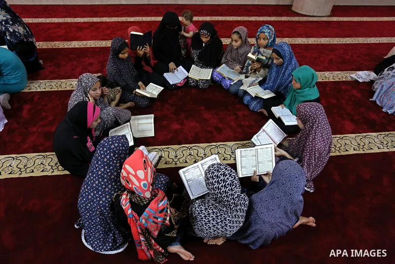 Palestinian girls attend a lesson of Koran, Islam's holiest book on the Muslim holy fasting month of Ramadan, at Hamad Mosque in Khan Younis in the southern Gaza Strip, June 14, 2017. Ramadan is sacred to Muslims because...