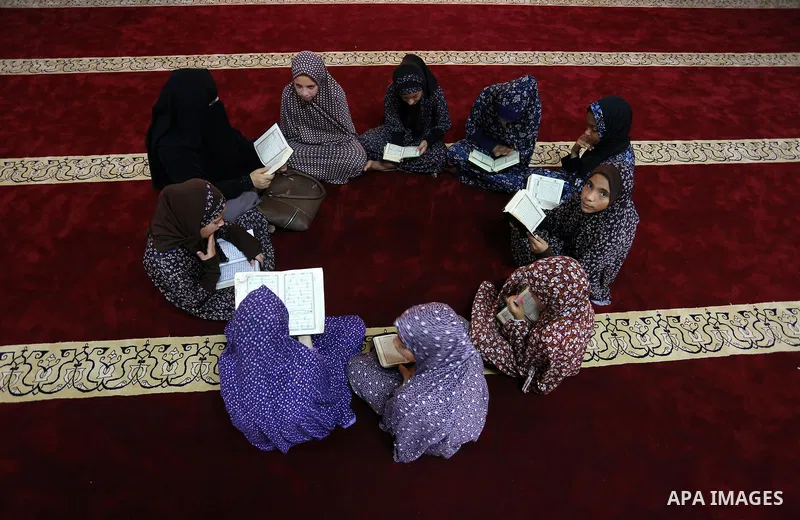 Palestinian girls attend a lesson of Koran, Islam's holiest book on the Muslim holy fasting month of Ramadan, at Hamad Mosque in Khan Younis in the southern Gaza Strip, June 14, 2017. Ramadan is sacred to Muslims because...