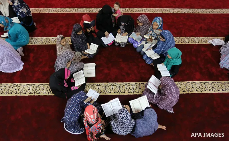 Palestinian girls attend a lesson of Koran, Islam's holiest book on the Muslim holy fasting month of Ramadan, at Hamad Mosque in Khan Younis in the southern Gaza Strip, June 14, 2017. Ramadan is sacred to Muslims because...