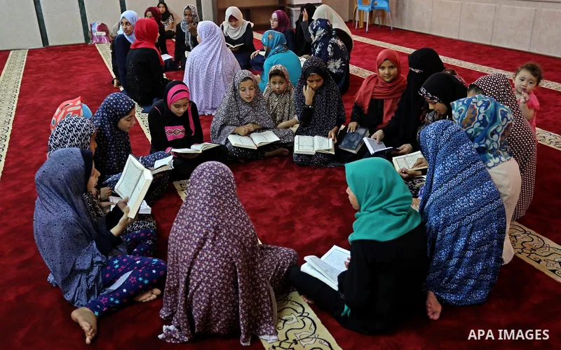 Palestinian girls attend a lesson of Koran, Islam's holiest book on the Muslim holy fasting month of Ramadan, at Hamad Mosque in Khan Younis in the southern Gaza Strip, June 14, 2017. Ramadan is sacred to Muslims because...
