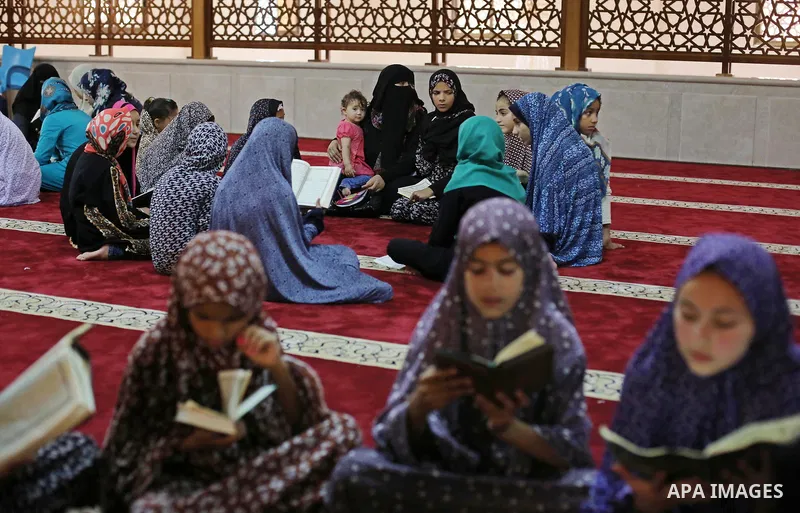 Palestinian girls attend a lesson of Koran, Islam's holiest book on the Muslim holy fasting month of Ramadan, at Hamad Mosque in Khan Younis in the southern Gaza Strip, June 14, 2017. Ramadan is sacred to Muslims because...