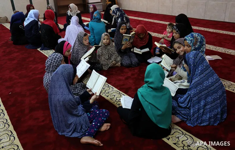 Palestinian girls attend a lesson of Koran, Islam's holiest book on the Muslim holy fasting month of Ramadan, at Hamad Mosque in Khan Younis in the southern Gaza Strip, June 14, 2017. Ramadan is sacred to Muslims because...