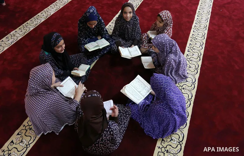 Palestinian girls attend a lesson of Koran, Islam's holiest book on the Muslim holy fasting month of Ramadan, at Hamad Mosque in Khan Younis in the southern Gaza Strip, June 14, 2017. Ramadan is sacred to Muslims because...