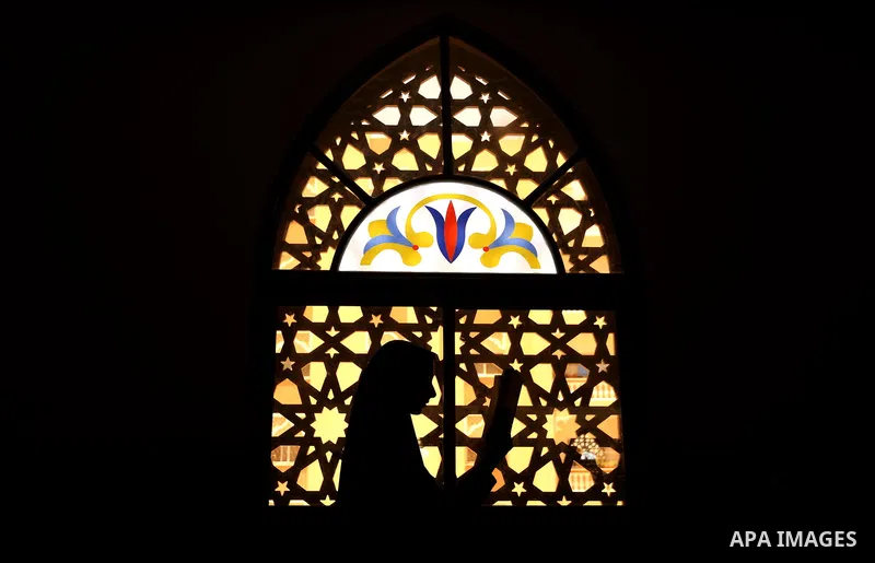 A Palestinian girl holds a copy of the Koran, Islam's holiest book, on the Muslim holy fasting month of Ramadan, at Hamad Mosque in Khan Younis in the southern Gaza Strip, June 14, 2017. Ramadan is sacred to Muslims beca...