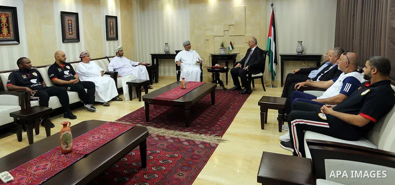 Palestinian Prime Minister Rami Hamdallah meets with head of the Omani Football union, Salem Al Wahaibi, in the West Bank city of Ramallah on June 14, 2017. Photo by Prime Minister Office
