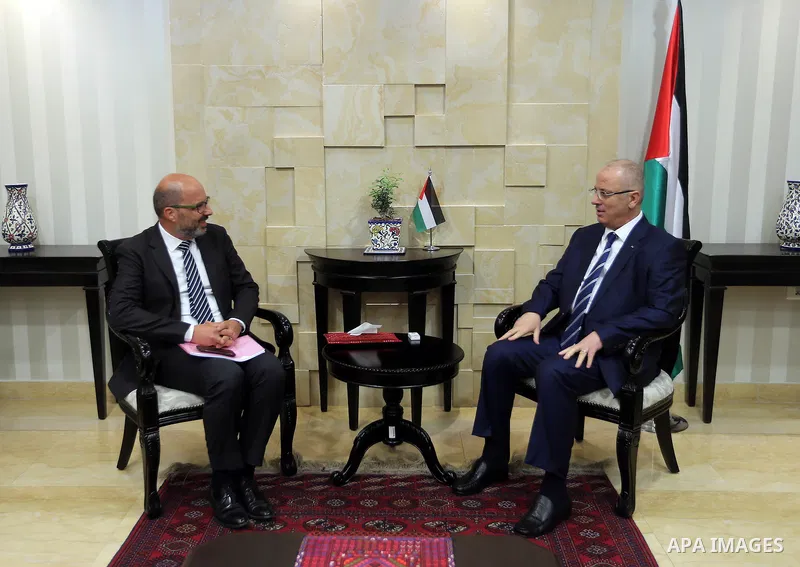 Palestinian Prime Minister Rami Hamdallah attends signing an agreement with United Nation, in the West Bank city of Ramallah on June 15, 2017. Photo by Prime Minister Office