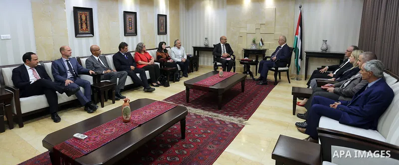 Palestinian Prime Minister Rami Hamdallah attends signing an agreement with United Nation, in the West Bank city of Ramallah on June 15, 2017. Photo by Prime Minister Office
